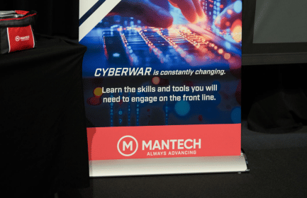 Two people collaborating at a laptop